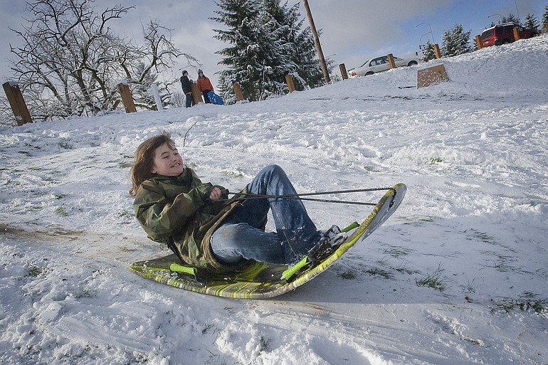 Sam Frailey, 10, takes a ride down a hill at Leverich Park on Thursday February 24, 2011.