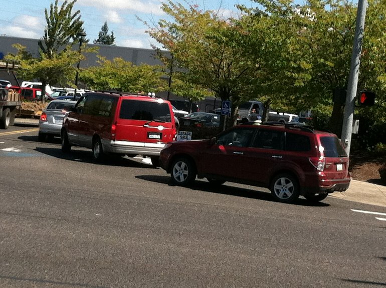 Cars backed up on Tenney Road Friday afternoon because of a traffic problem caused in the Fred Meyer parking lot where there is major road construction going on.