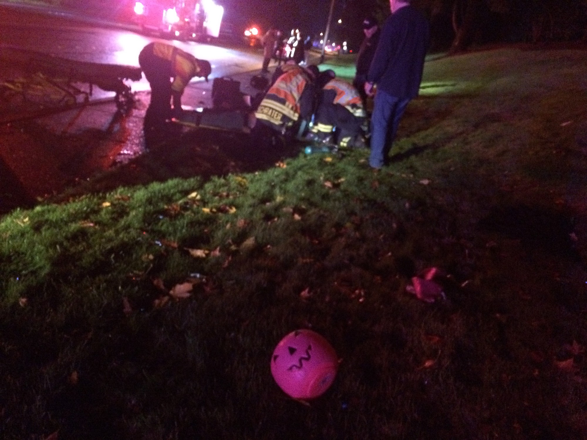 Emergency crews treat pedestrians who were hit by a car Friday night on a sidewalk on Northeast 112th Avenue in Vancouver.