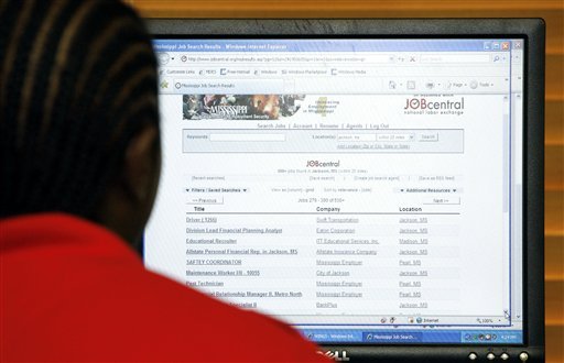 Corey Perry of Jackson, reviews possible jobs online at a state employment center in Jackson, Miss., Thursday, July 7, 2011. Unemployment rises to 9.2 pct. in June, as employers add only 18,000 jobs. (AP Photo/Rogelio V.