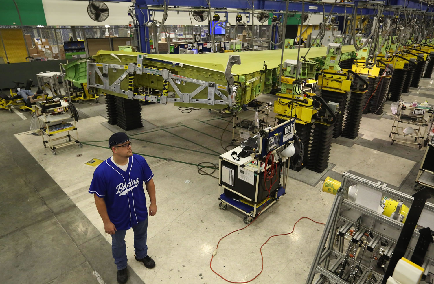 Gary Laws, a team-lead mechanic who works at Boeing's 737 wing-assembly facility in Renton, says an automated fastener machine has transformed his job.
