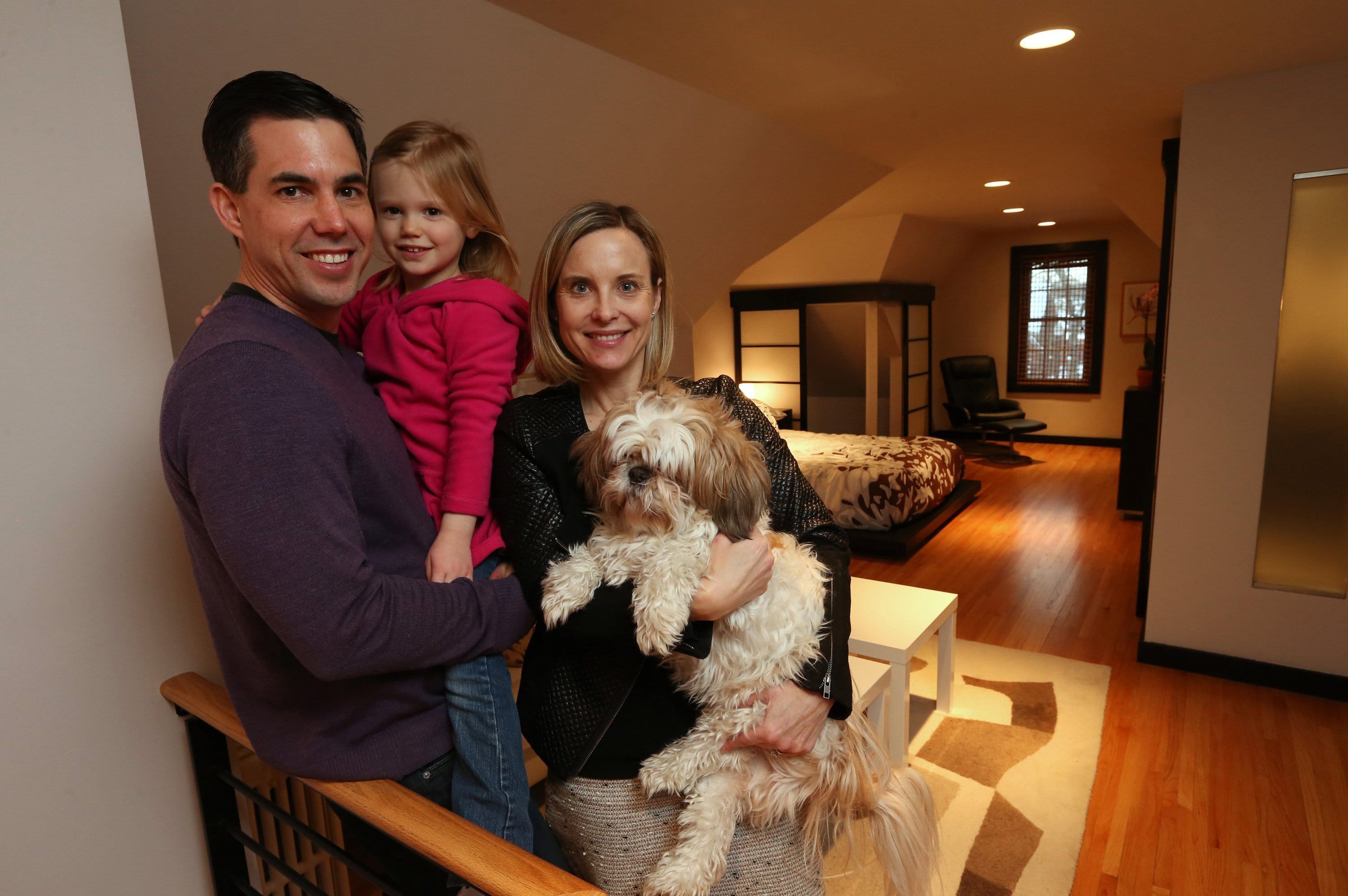 Dan and Nancy Griffin and their daughter in their converted attic suite in their Minneapolis home.