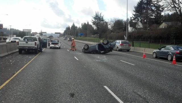 Three vehicles collided on Interstate 205 near Clackamas Friday morning after a dog got onto the freeway.