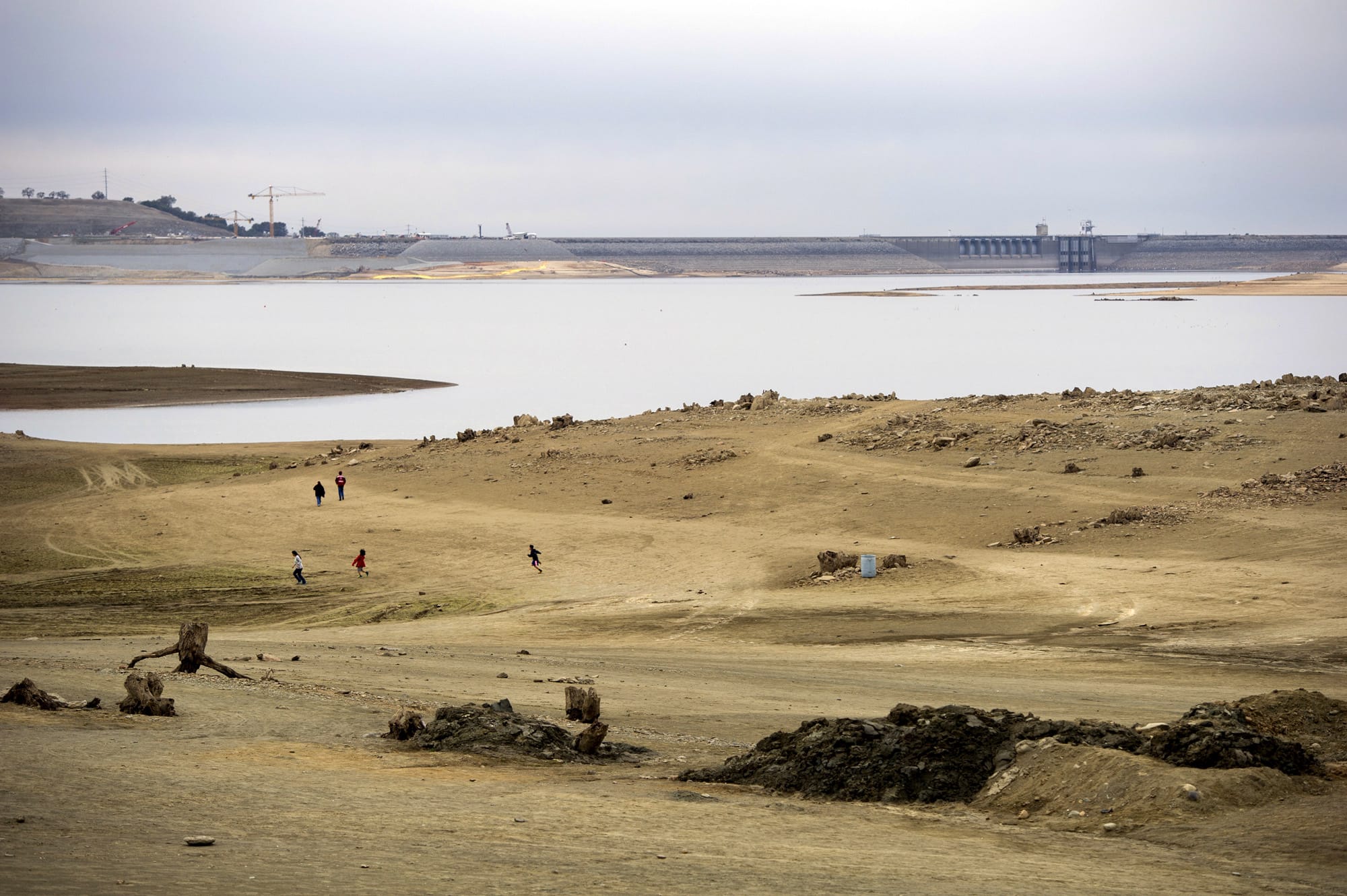 Visitors walk out to the old Mormon Island Gold Rush at Folsom Lake, Calif.