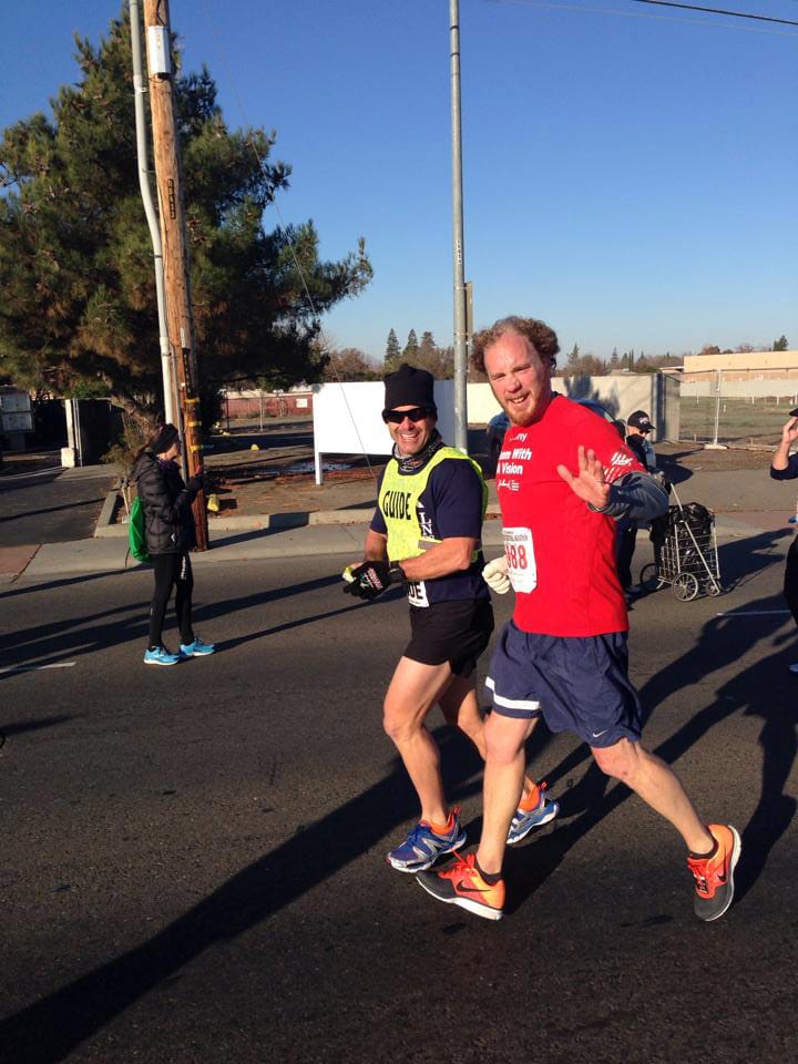 Kyle Robiduox (right) finished in third place in his division with the help of his guide Dan Streetman at the California International Marathon, in Sacramento. Robiduox is training for the Boston Marathon.