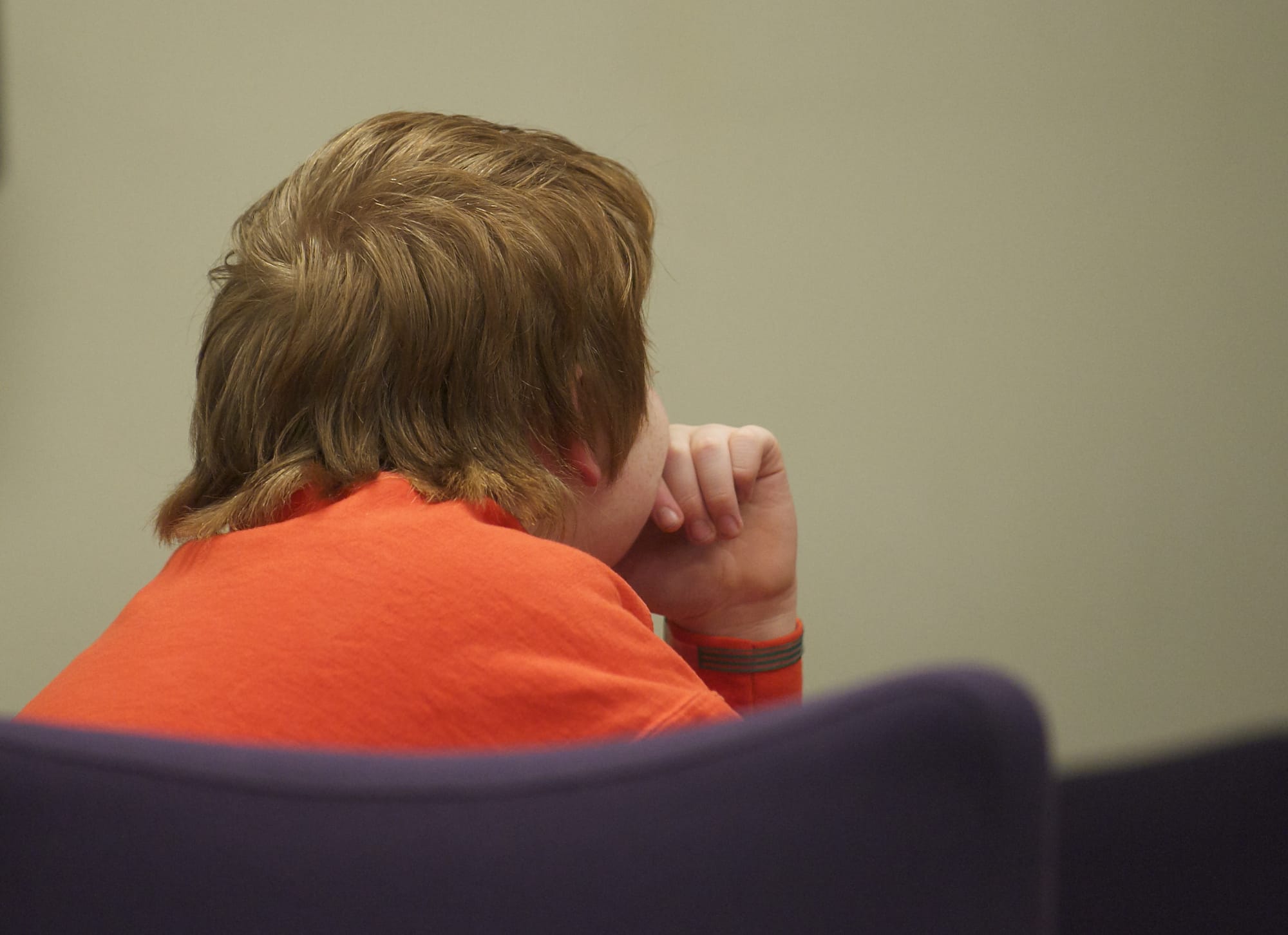 Twelve-year-old Quincy Tuttle sits in court in January.