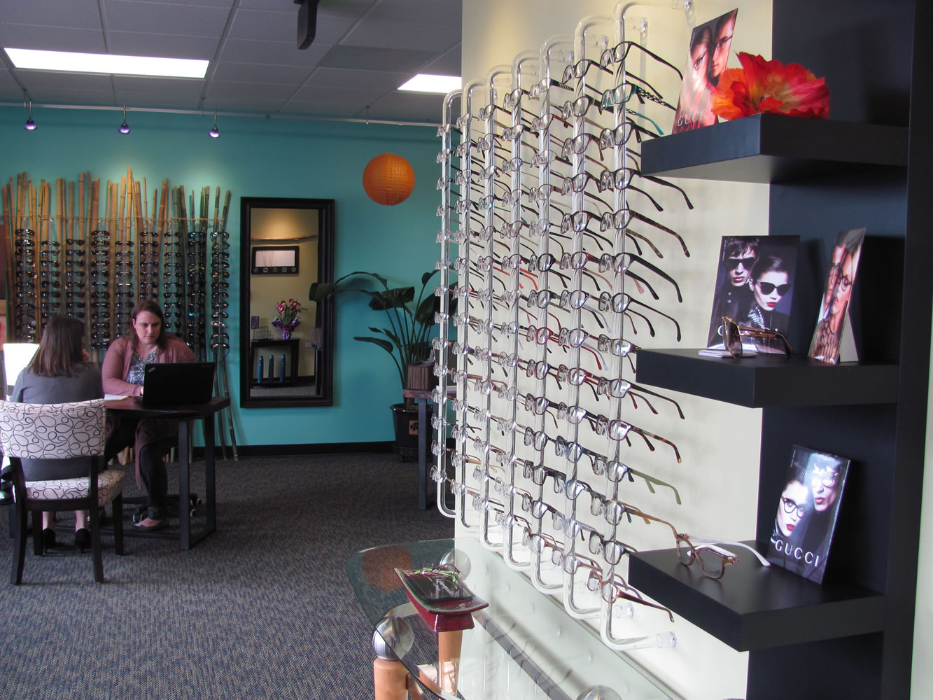 Julie Post, an optician at Vancouver Vision Clinic, assists a patient with the process of ordering glasses. The clinic recently relocated within downtown Camas. &quot;We outgrew our other space,&quot; Post said.