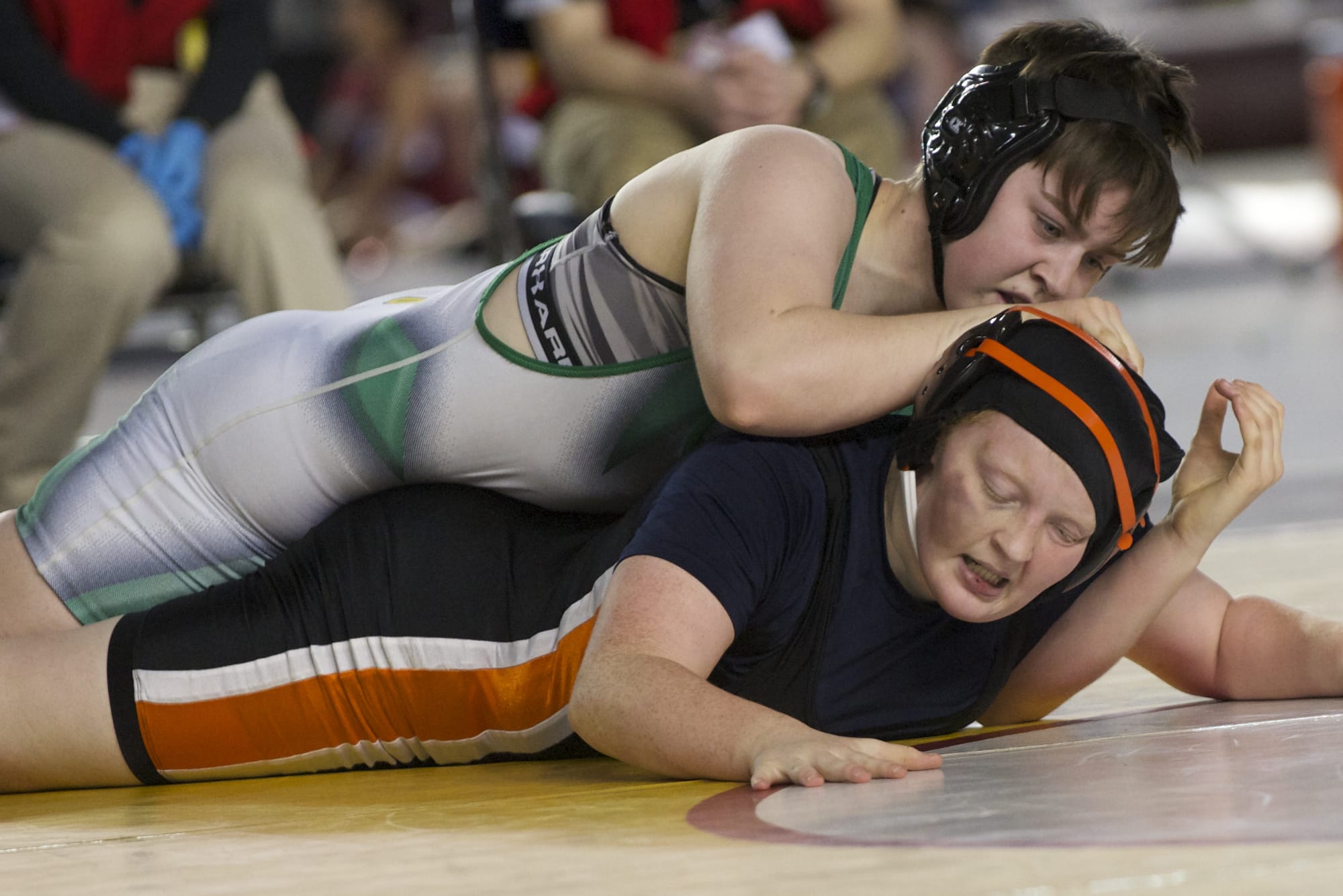Washougal's Abby Lees, bottom, competes in the Mat Classic state wrestling championships.