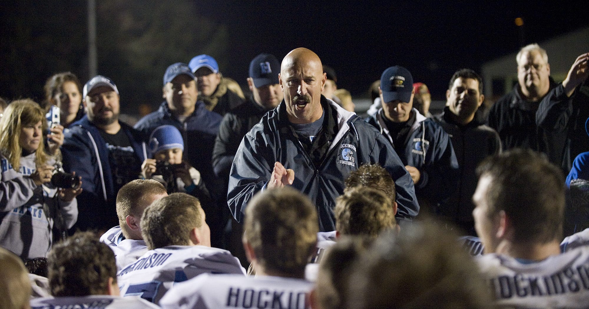 An emotional Hockinson head coach Rick Steele talks to his team after beating Woodland for the league title, Friday, Oct.