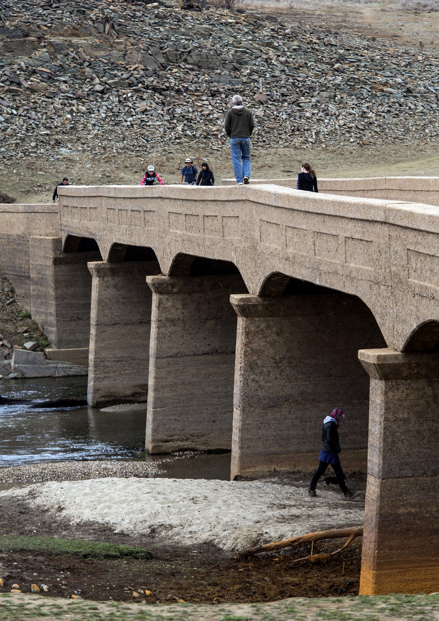 Visitors walk over Salmon Falls Bridge, normally submerged under water, at Folsom Lake in California last month.