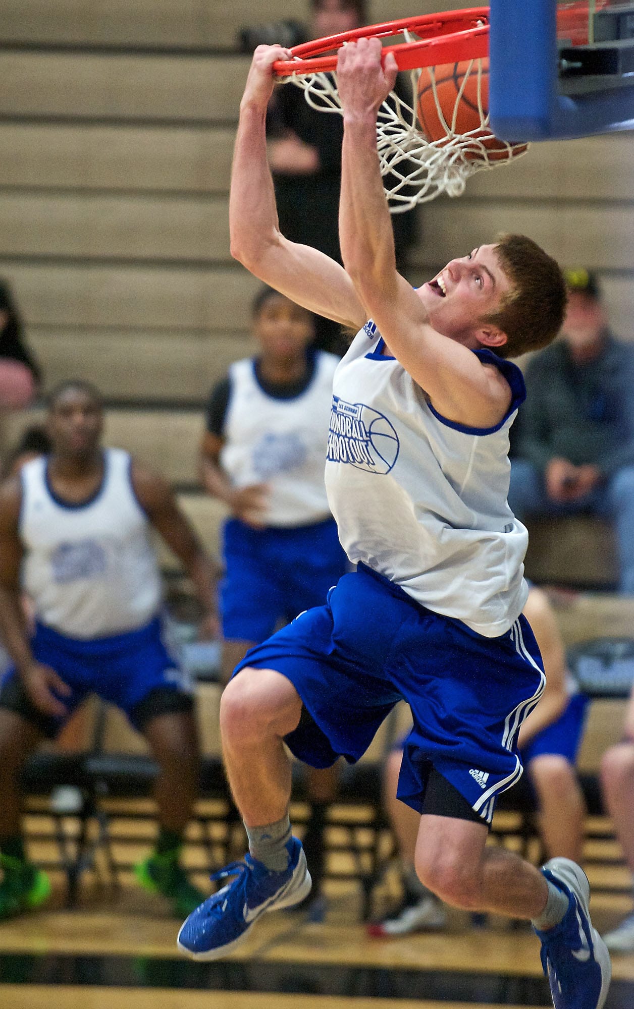 Hockinson's Jack Klodt throws down a mean reverse dunk to win the slam dunk contest during the Roundball Shootout at Clark College on Sunday.
