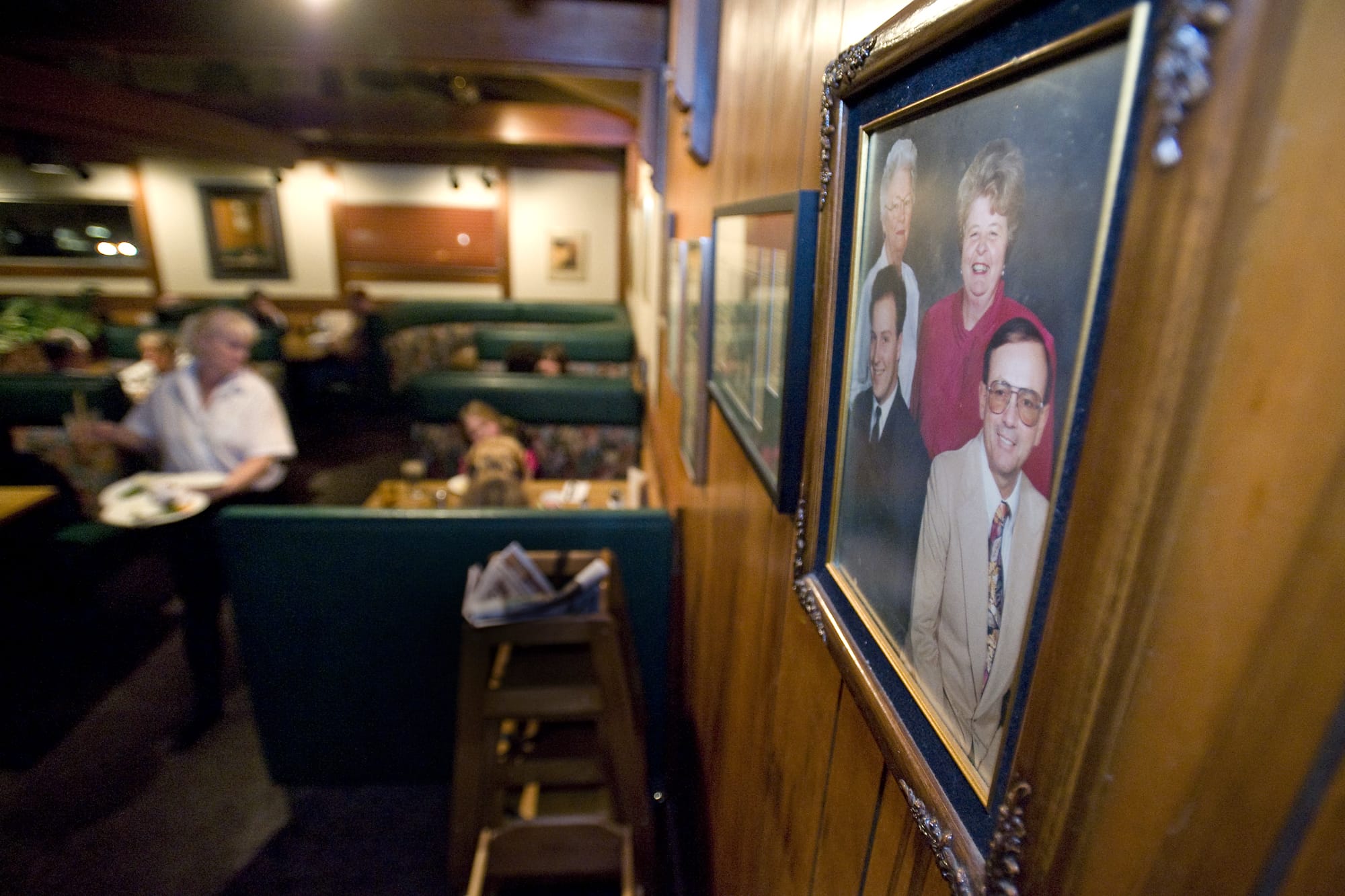 A family photo of Rosemary Teel, Jane Wiger, Ron Wiger and Alan Teel - operators of Bill's Chicken and Steak House - hangs in the dinning room. The venue has sold after 49 years of business in Vancouver at the corner of St.