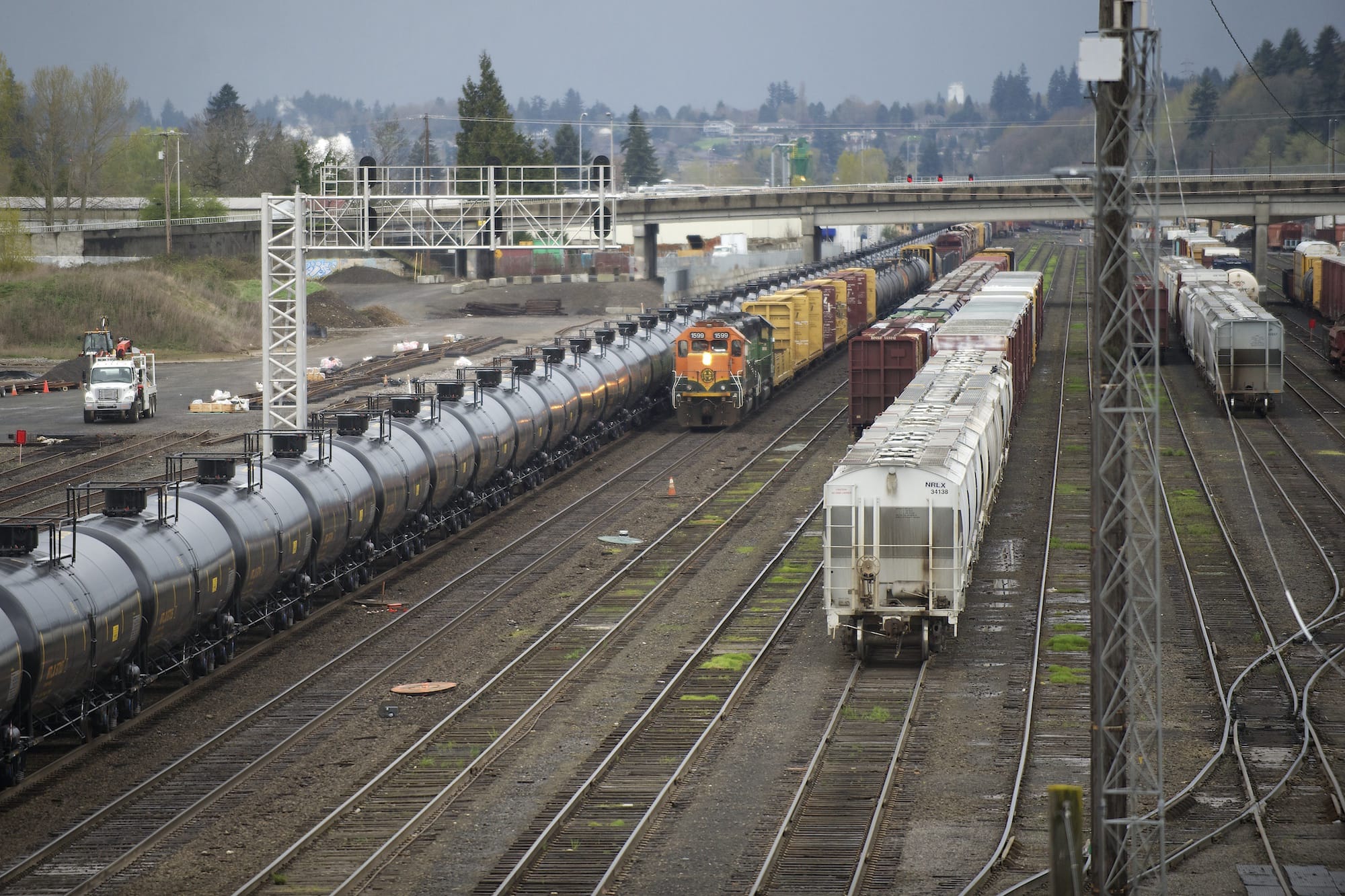 Oil tank cars move through a rail yard Wednesday in Vancouver.