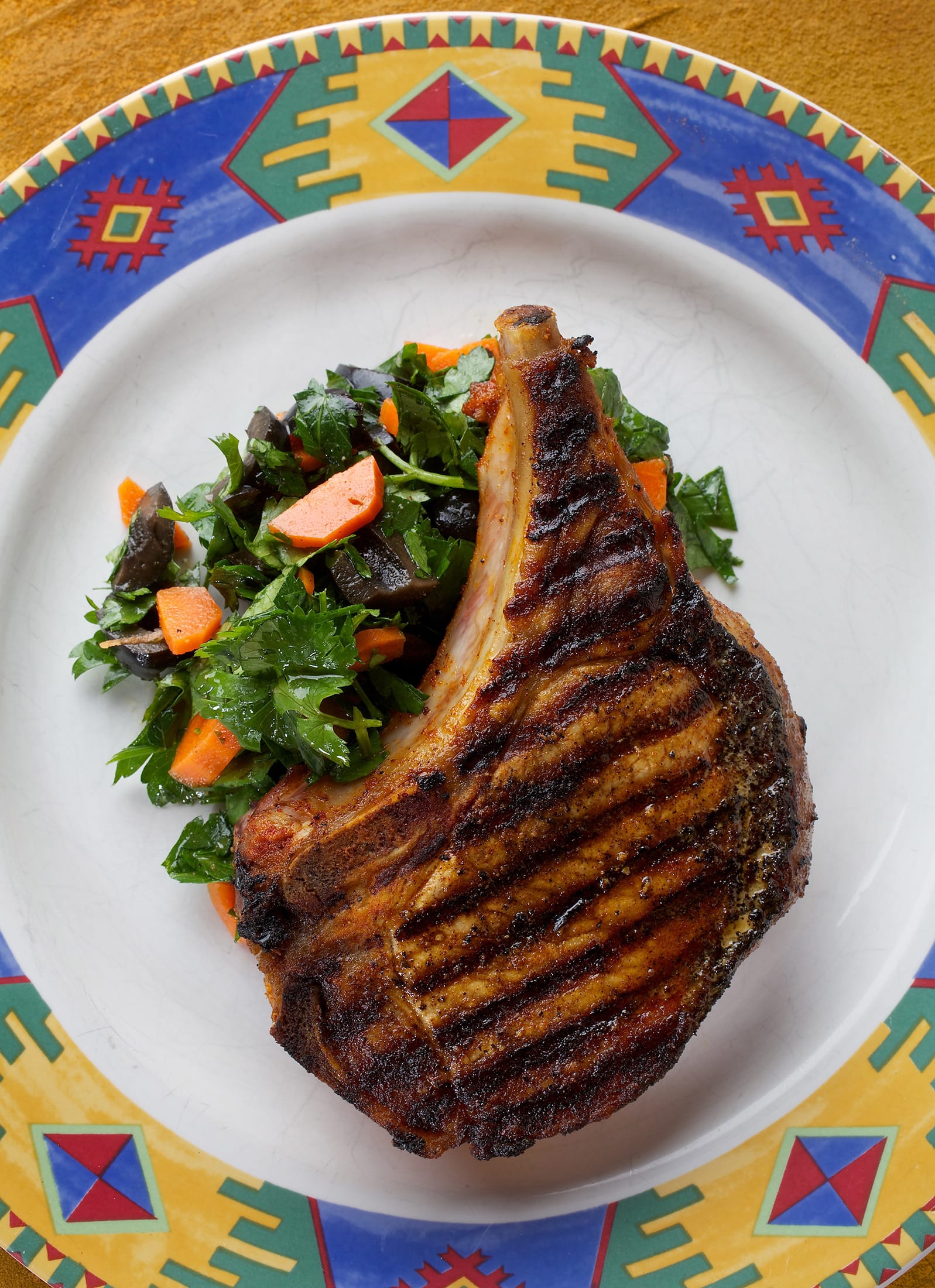 Paprika Pork Chops With Carrot and Olive Salad.
