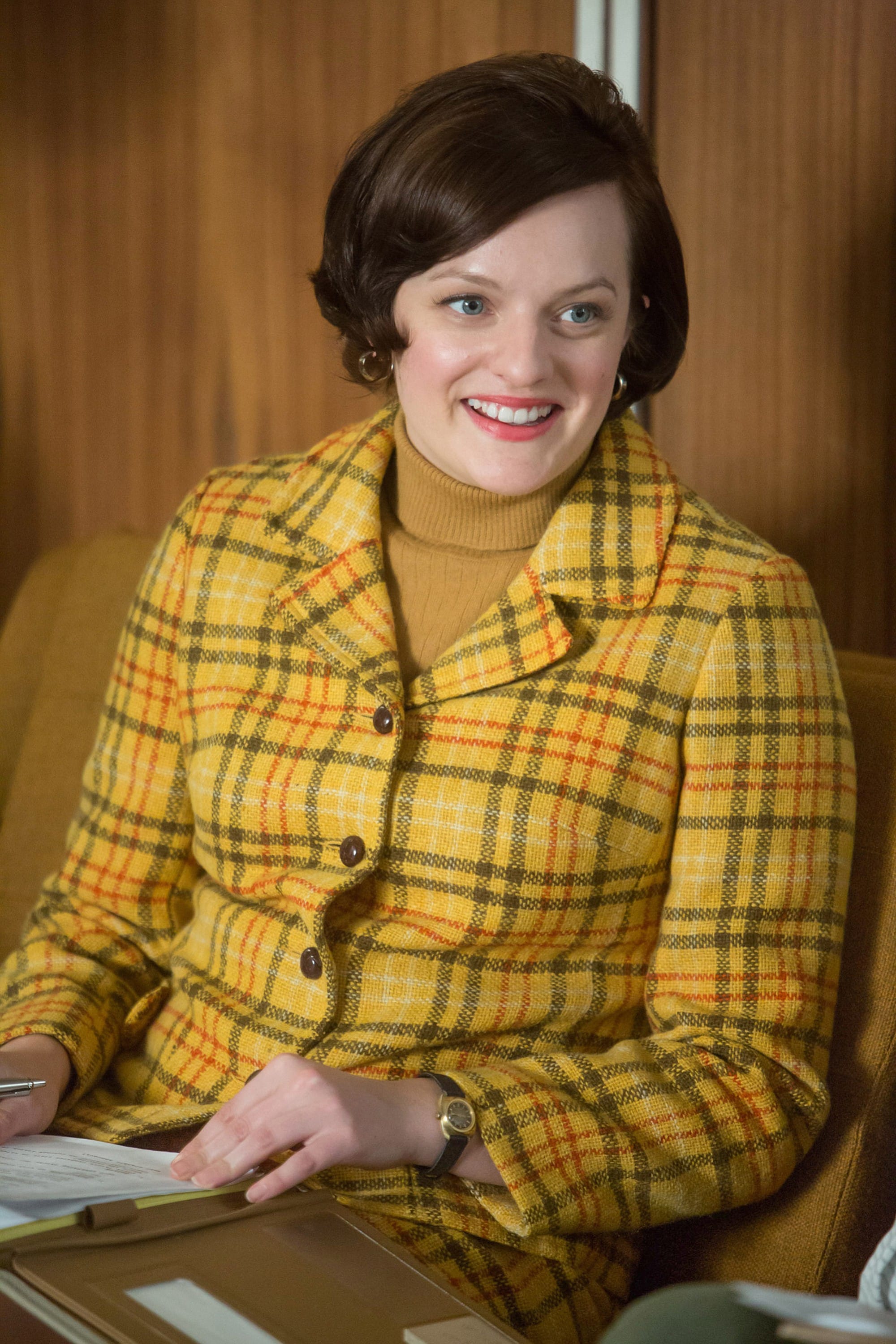 Pegg's plaid pantsuit served as a symbol of women's new-found power in the workplace.