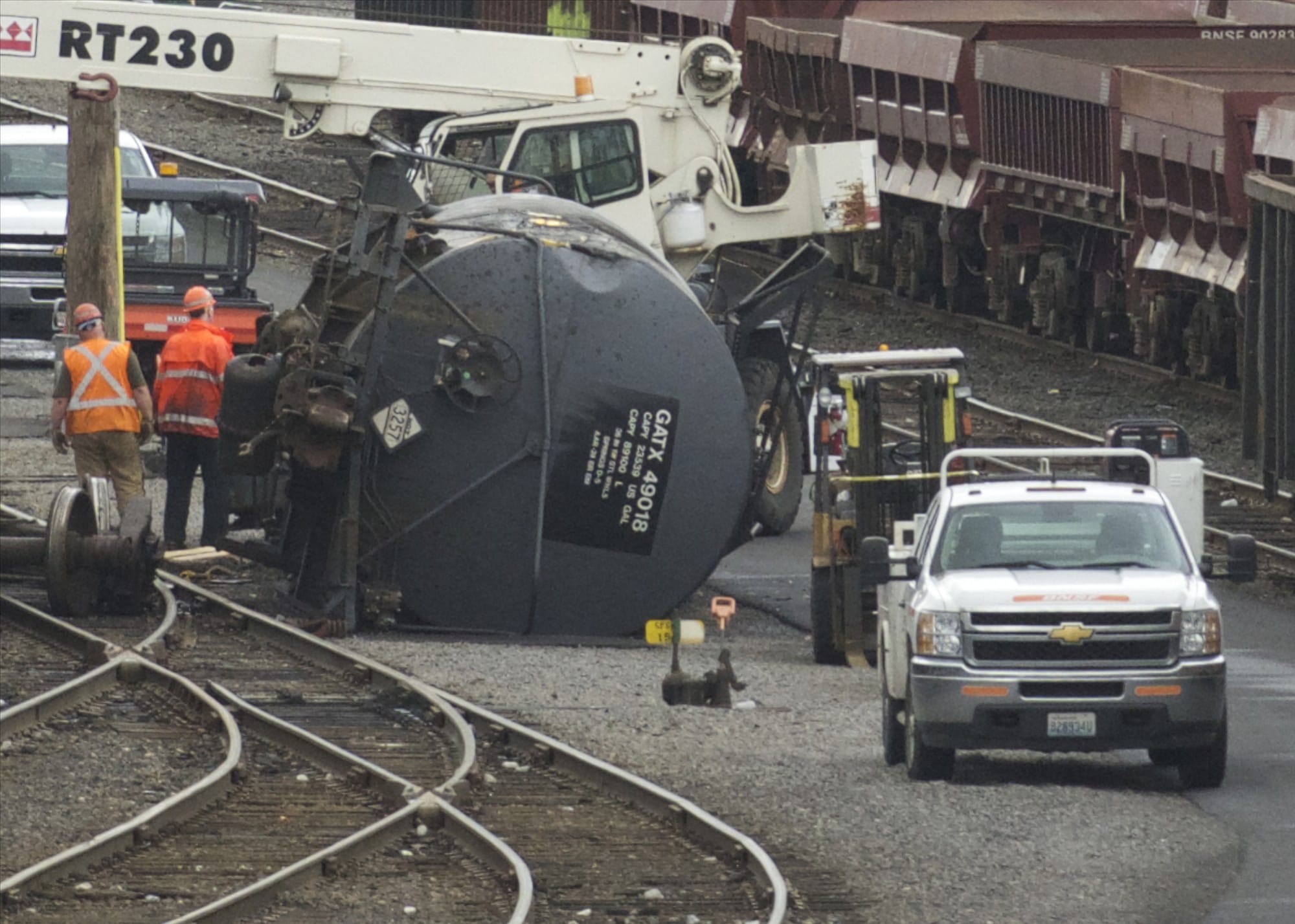 Columbian files
Crews work to right a derailed tank car containing liquid asphalt in BNSF Railway's Vancouver yard near the Fourth Plain Boulevard overpass on June 27, 2014. It was one of 33 reportable incidents in Clark County in a decade.