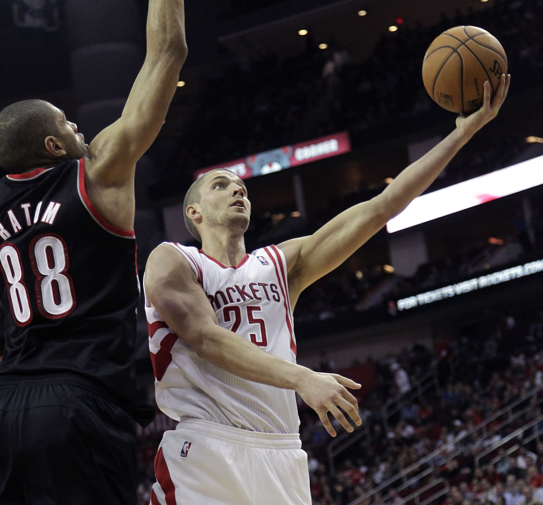 Houston's Chandler Parsons (25) drives to the basket past Portland's Nicolas Batum (88) during a game played in January in Houston.