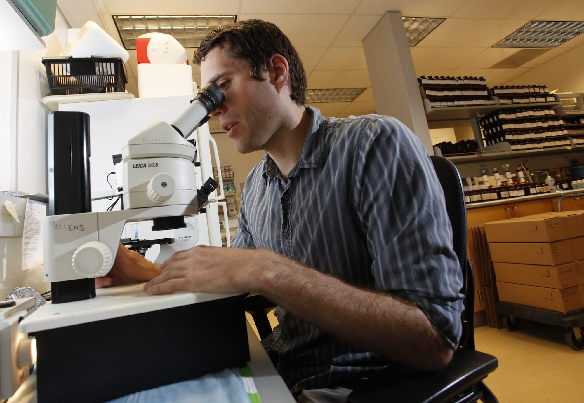 WSU Vancouver graduate student Eric Dexter examines plankton he's gathered in the Columbia River. Dexter  learned last week that he's been chosen as a participant in the 2014-15 core Fulbright U.S.