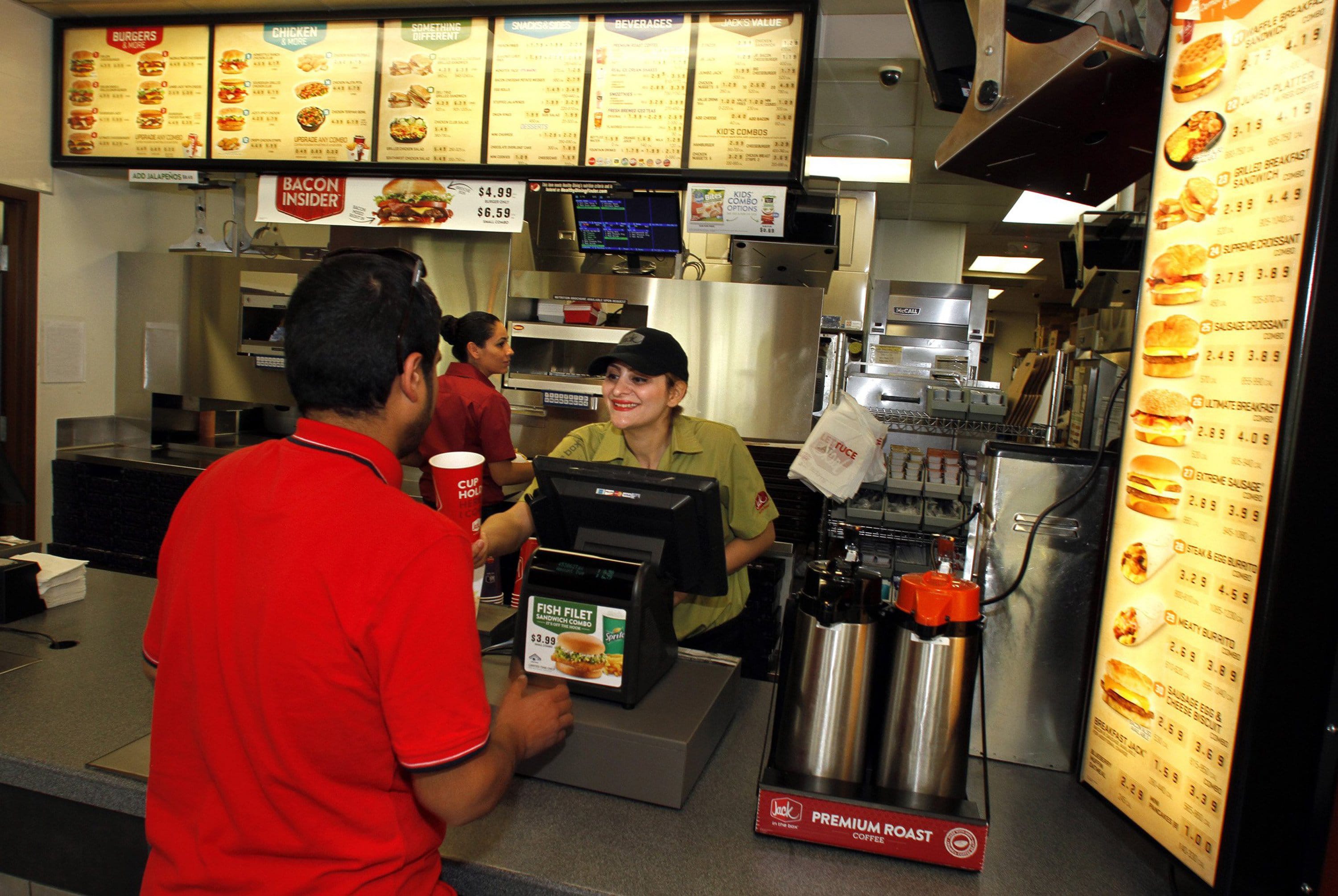A customer orders food during lunchtime at a Jack in the Box restaurant in Irvine, Calif., on April 8.