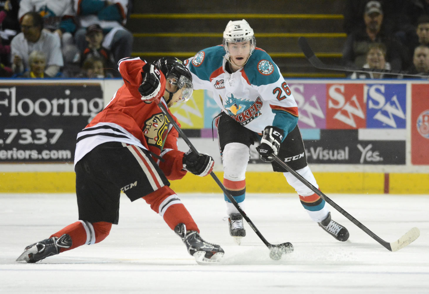 Kelowna Rockets, Cole Linaker tries to steel the puck away from Portland Winterhawks, Brendan Leipsic on a power play opportunity for the hawks during WHL first period game 5 play off action at Prospera Place on Friday evening.