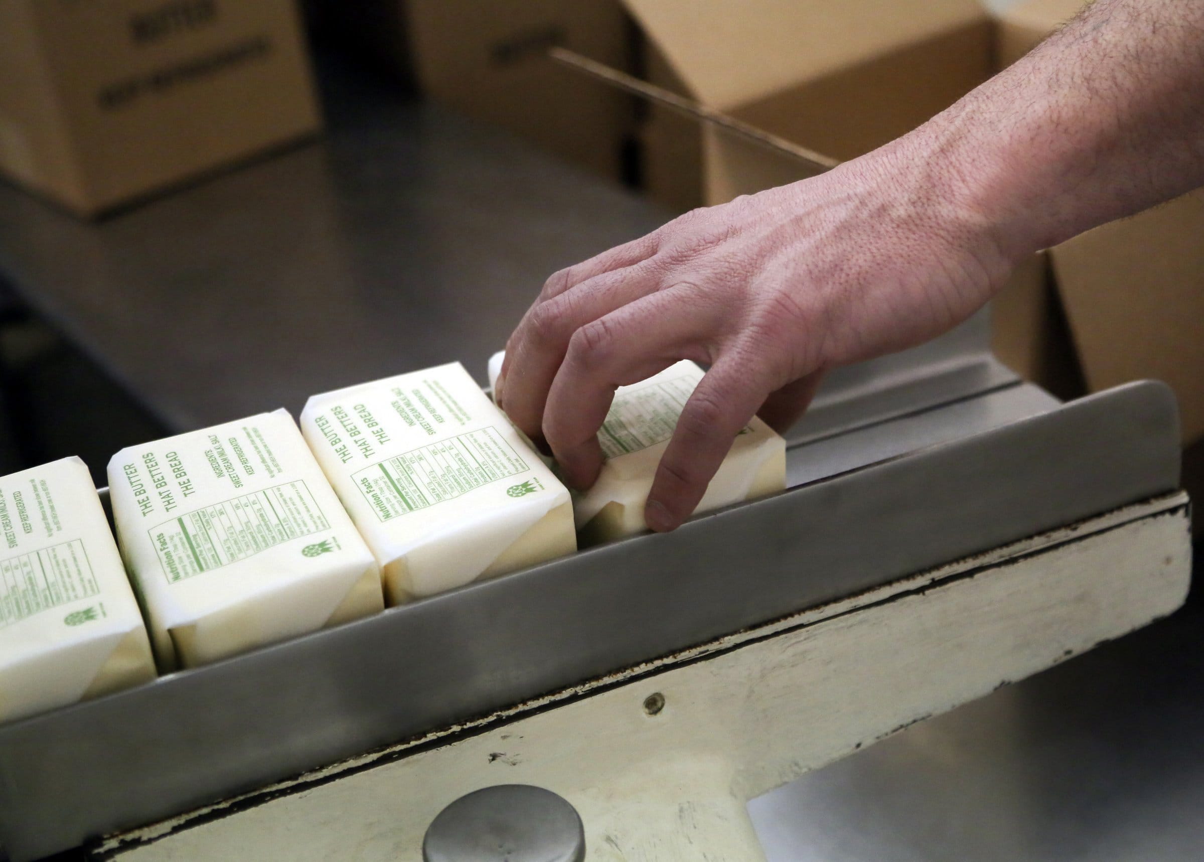 David Joles/Minneapolis Star Tribune
Production worker Shane Malherek boxes up one pound chunks of freshly churned butter April 10 at Hope Creamery in Hope, Minn.