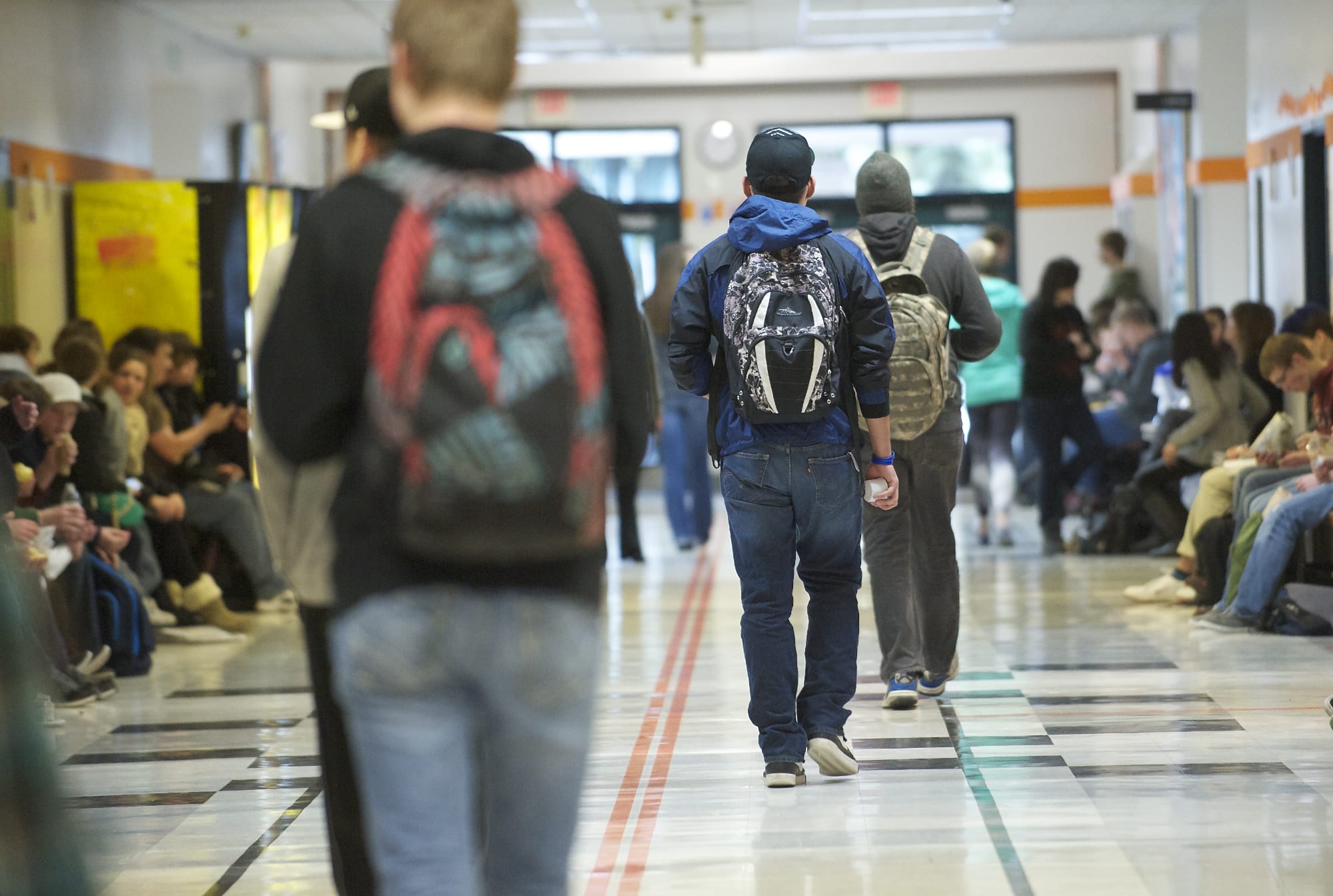 A hall at Battle Ground High School is filled with students in February.