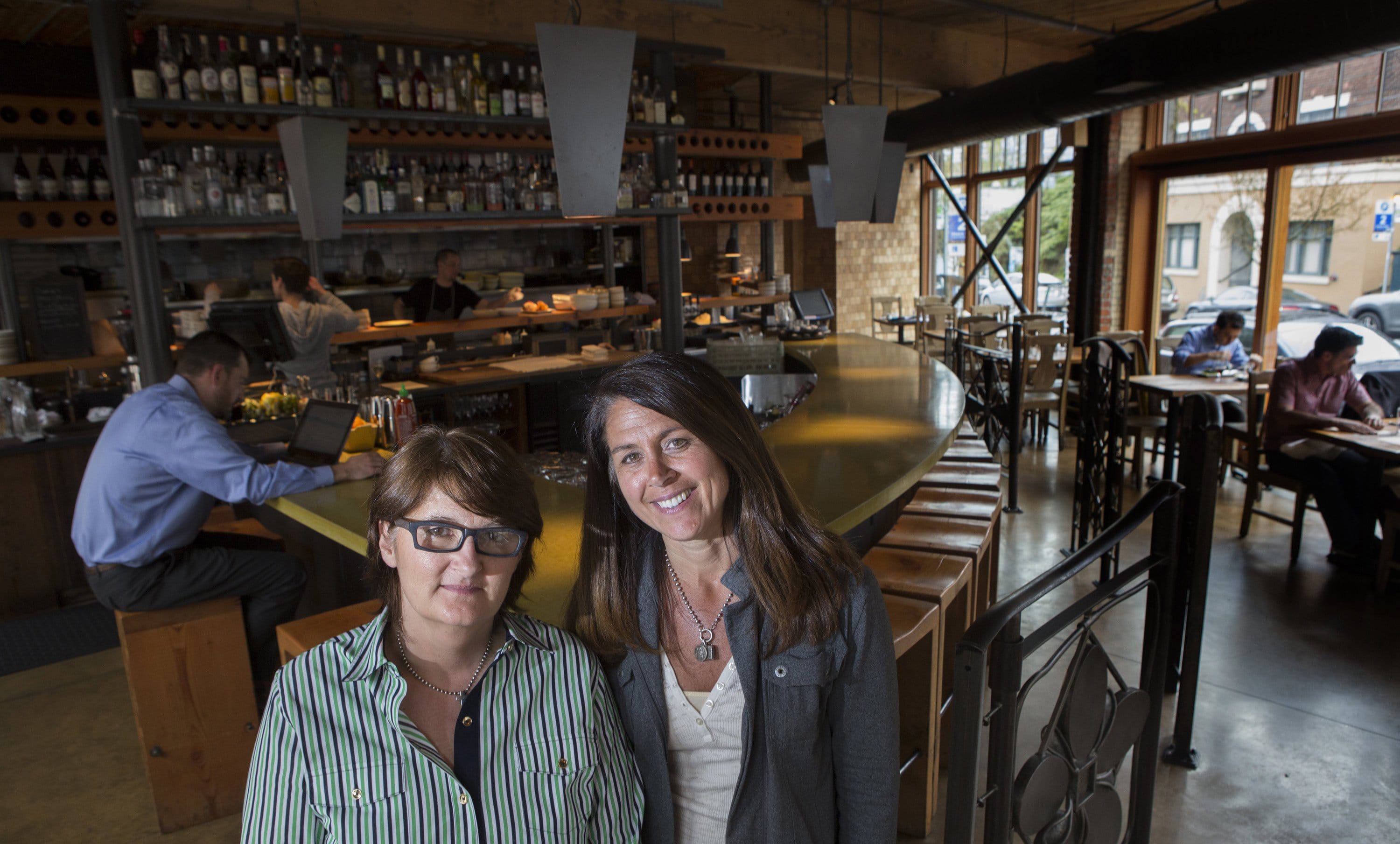 Tamara Murphy, left, and Linda Di Lello Morton, owners of Terra Plata in Seattle, are among many in the restaurant industry who worry about the effects of a proposed $15 minimum wage in the city.