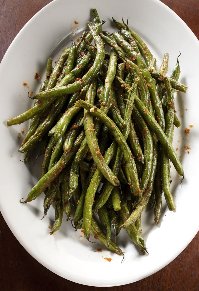 The slow roasted, quick fried, chili-spiked, sesame-warmed bean is an intensely flavorful delight.