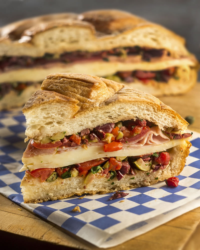 The muffuletta sandwich is wide and low.