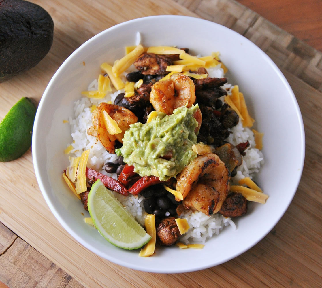 The Mexican Chicken and Shrimp Rice Bowl recipe is a jumping-off point with the flexibility to swap steak to chicken, or brown rice to white.