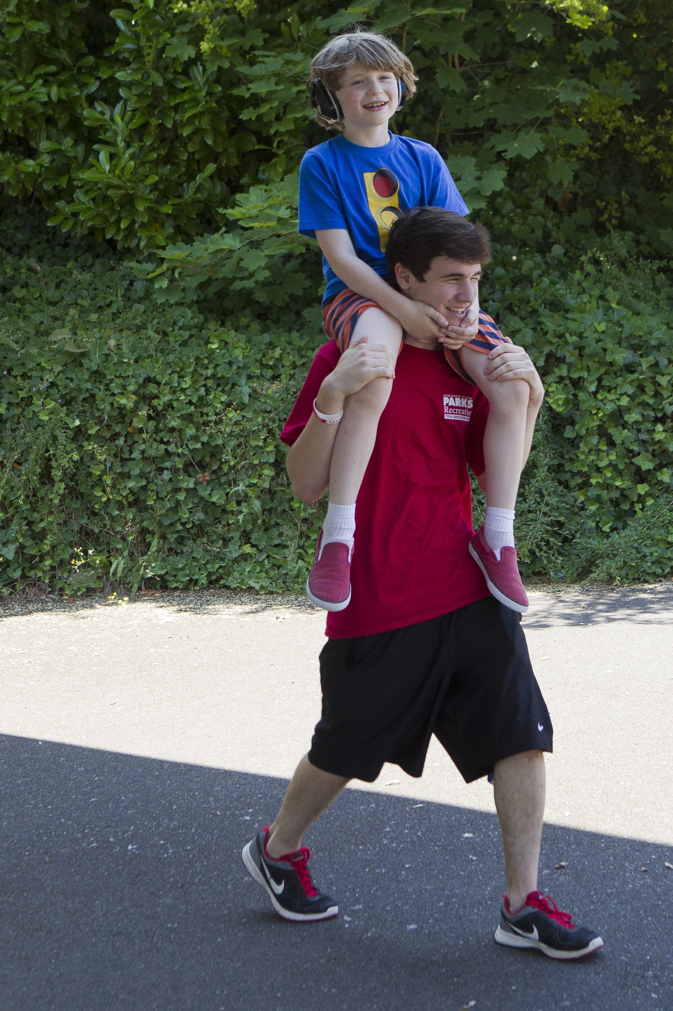 Esther Short: Trevor Saleg gives a lift to Jacob Wood at Sensory Camp, which caters to kids on the autism spectrum and with other special needs, in 2013.