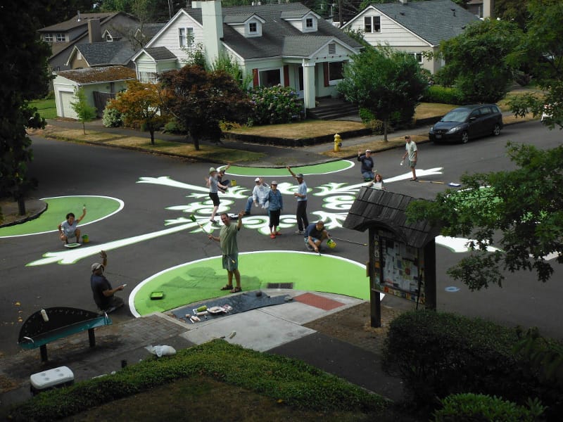 Arnada: This upper-story view shows the volunteer crew retouching the street mural at 22nd and D Streets.