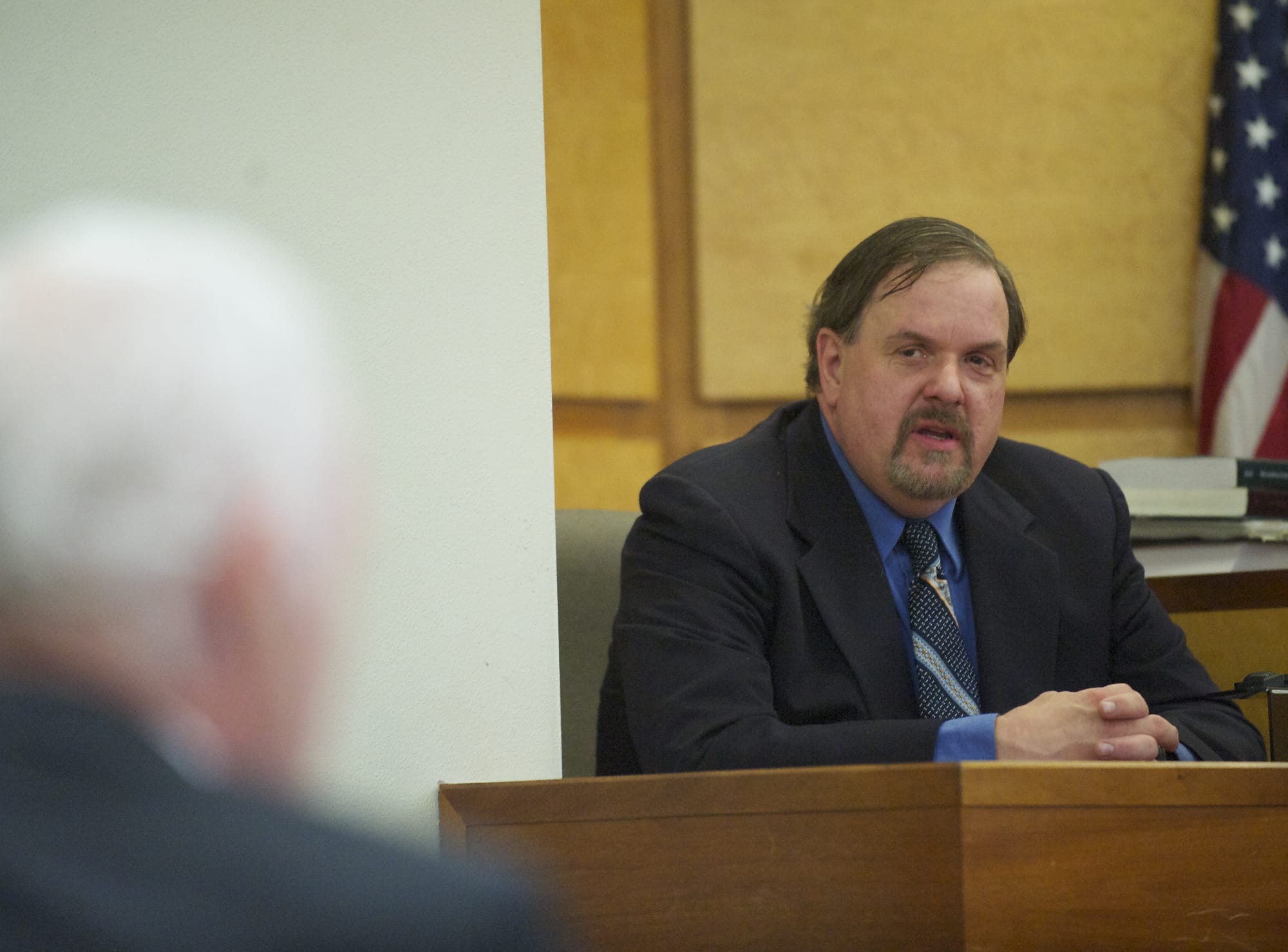 Former Washougal police Officer Robert Ritchie takes the witness stand during his assault trial March 14, 2013, inside Clark County District Judge Sonya Langsdorf's courtroom.