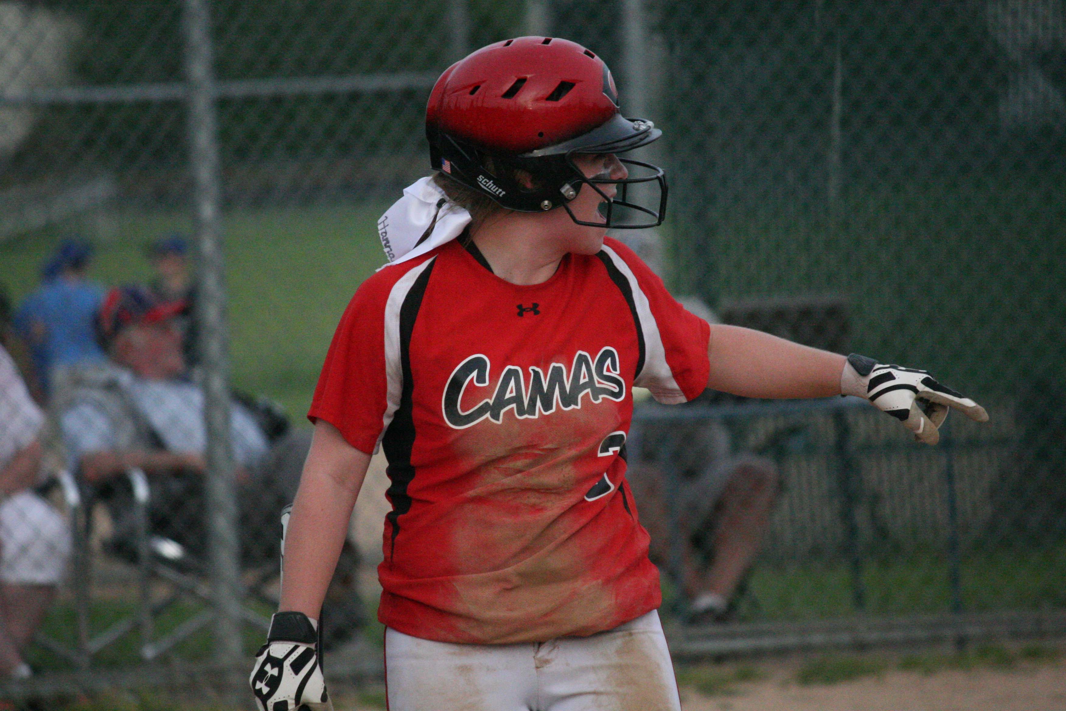 Hannah Welborn points to Katie Schroeder after scoring a big run for the Camas softball team in the seventh inning.
