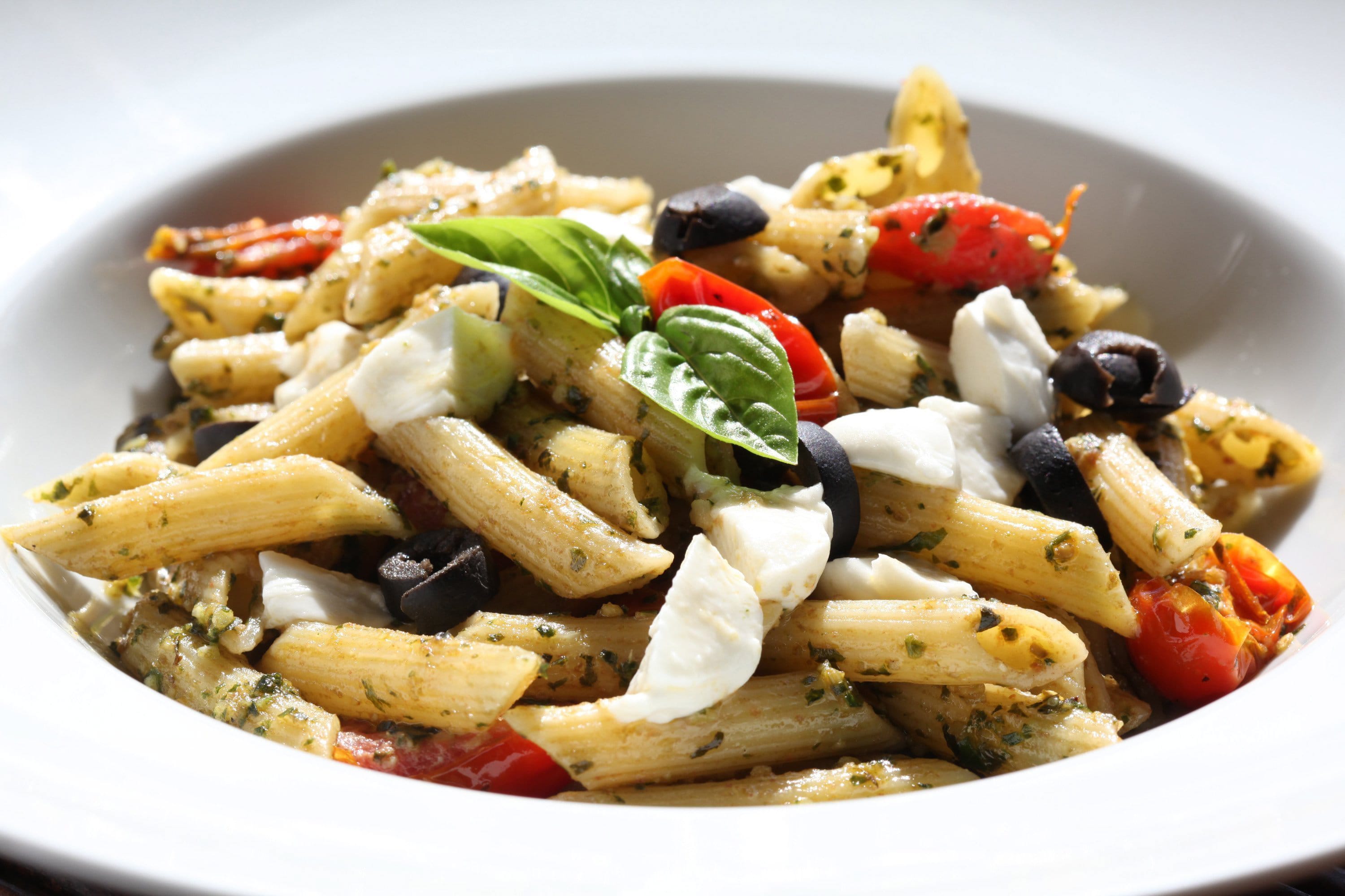 Penne With Pesto, Tomatoes, and Olives is a simple dish to make but packed with a wealth of bright flavors.