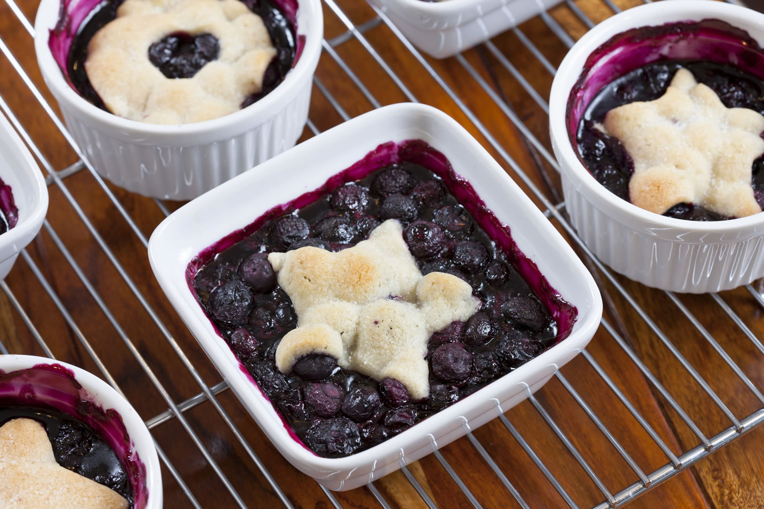 Stacy Zarin Goldberg
The Washington Post
Cookie-Topped Blueberry Mini Pies.