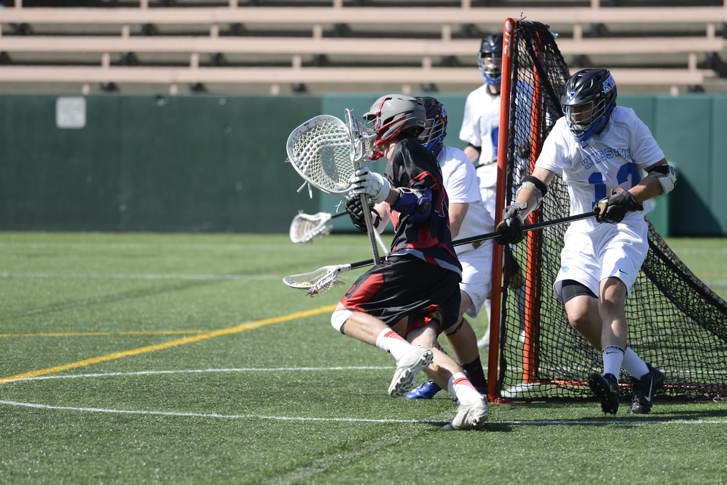 King's Way lacrosse defender Brandon Pearl, right, defends against Seattle Academy in Saturday's high school championship game at Seattle's Memorial Stadium.