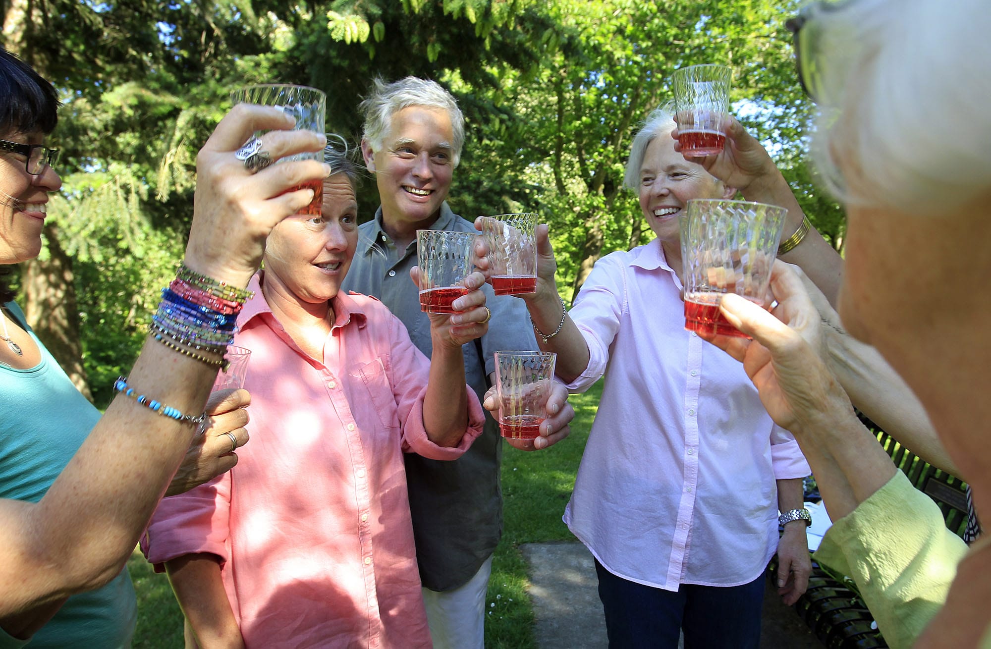Alison Shiboski, second left, and Dorothy Dilliplane, second right, celebrate June 4 with friends after a ceremony marking their third wedding ceremony in Eugene, Ore.