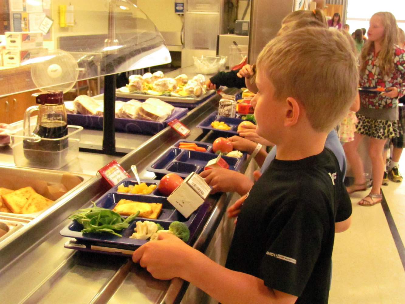 Lacamas Elementary School student Jesse Raunig has several servings of fruits and vegetables on his lunch tray.