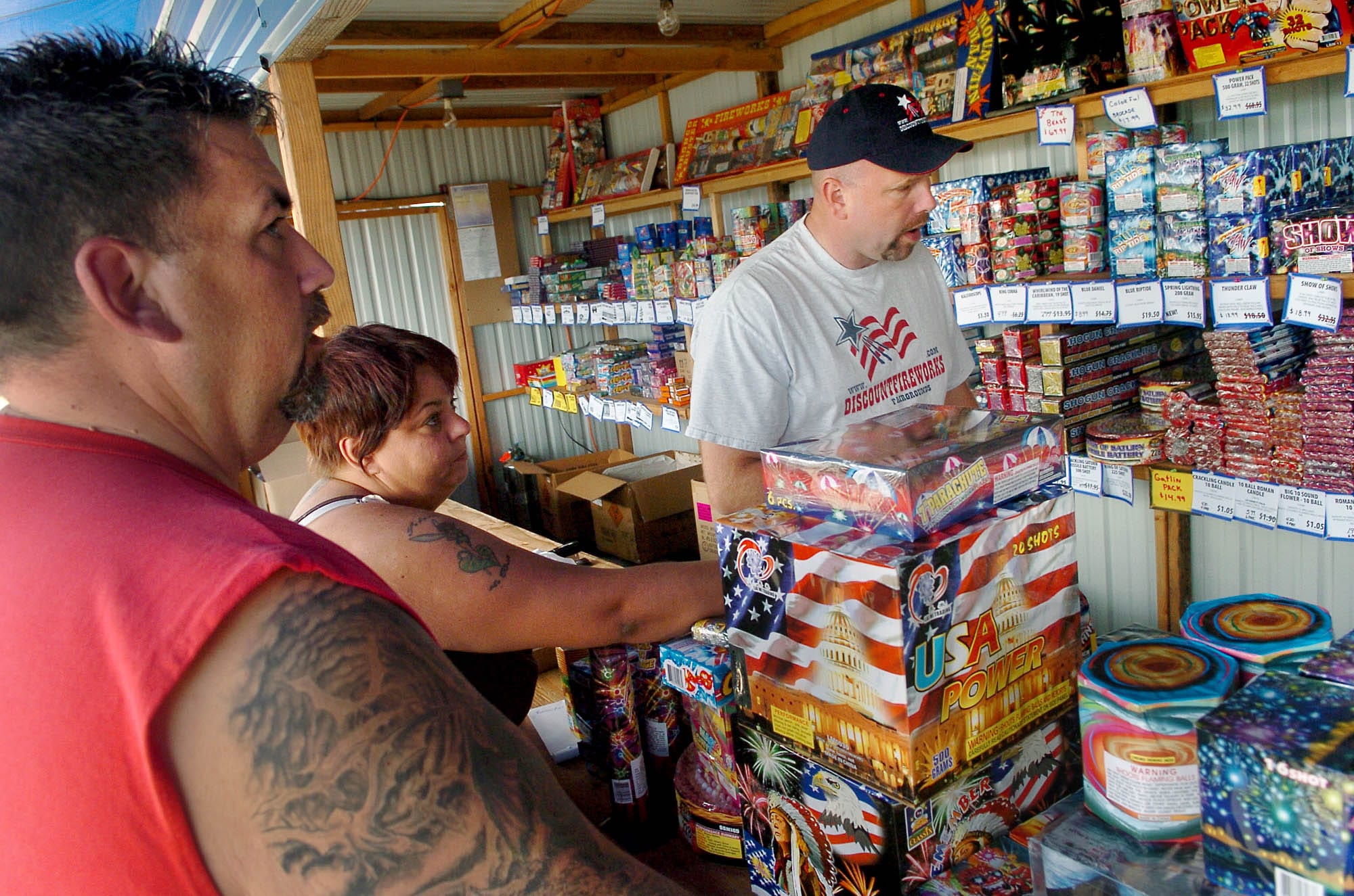Bill and Twila Williams of La Center make their fireworks selections in 2007 as Lonnie McCann of Discount Fireworks assists at the stand located near the Clark County Fairgrounds. Clark County residents have the opportunity this election to vote on up to six nonbinding questions proposed by Clark County commissioners.