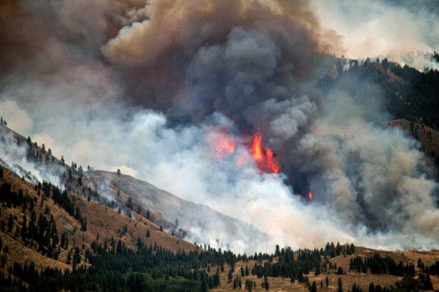 The fire risk is high in much of Oregon and in Central Washington 
 A wildfire, known as the Carlton Complex fire, burns out of control near Winthrop, Wash., July 18, 2014. Soldiers assigned to the 66th Theater Aviation Command, Washington Army National Guard, brought six helicopters to the area to assist firefighters on the ground.