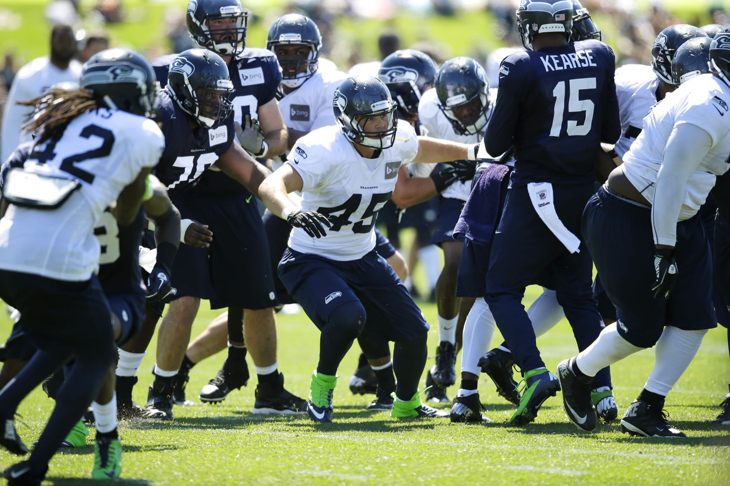Seattle Seahawks linebacker Brock Coyle (45), center, takes part in a practice drill during NFL football training camp, Thursday, July 31, 2014, in Renton, Wash.