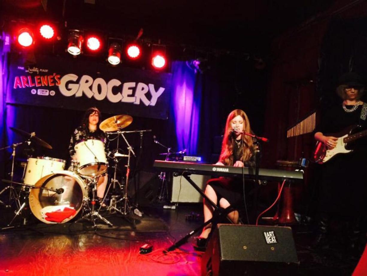 Chriss Williams/The Washington Post
Bulletproof Stockings perform at Arlene's Grocery in New York. The lead members, Dalia Shusterman on drums and keyboardist Perl Wolfe, were accompanied by a guitarist at right. The band members are Hasidic Jews and can only play for female audiences.