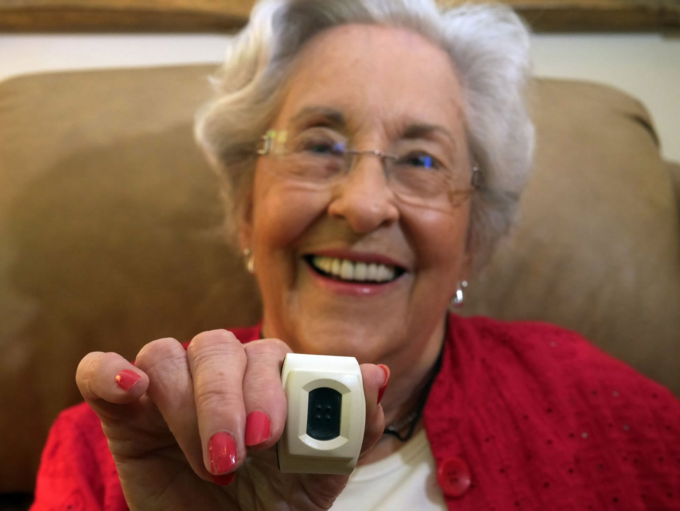 Betty Lewis, 90, a resident at The Plaza at Edgemere in North Dallas, wears the Phillips Life Line, a pendent alert system that informs Edgemere staff when a resident has fallen.