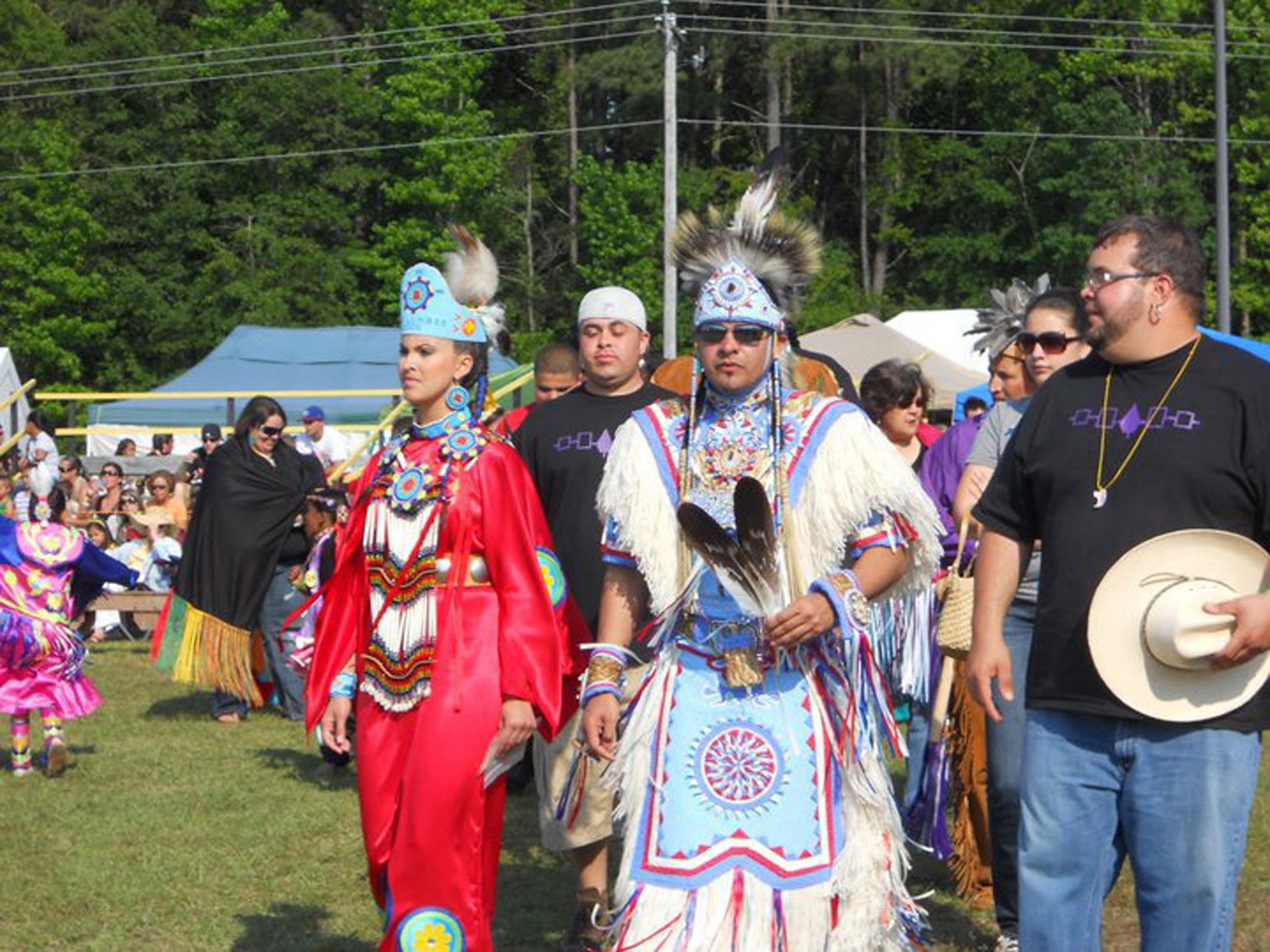 Rob Jacobs, center, a member of North Carolina's Lumbee Tribe, wore his eagle feathers at a Lumbee powwow.