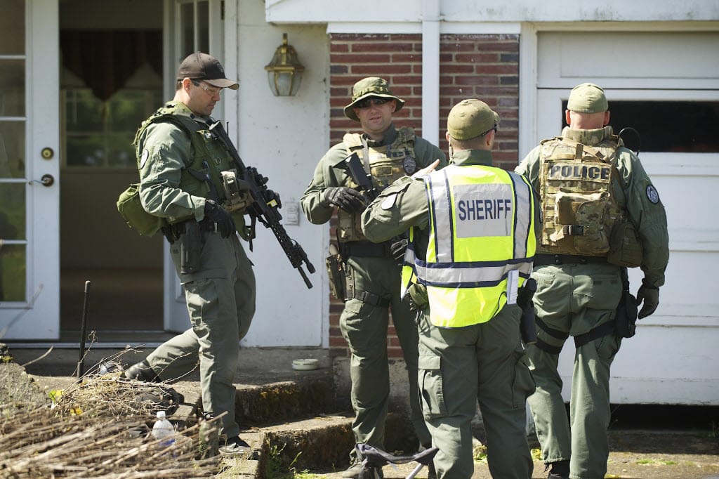 Columbian files
Members of a Clark County SWAT team train in April at a Vancouver home slated for demolition.