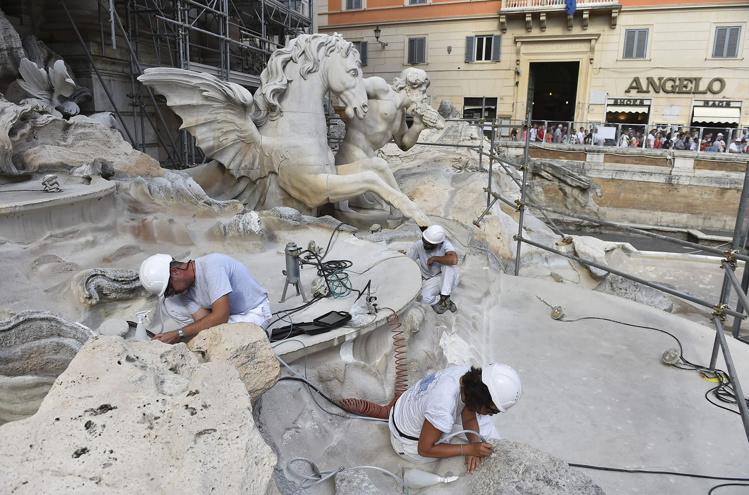 A crew works in August on the restoration of Rome's Trevi Fountain, supported in part by $2.8 million from the luxury fashion house Fendi.