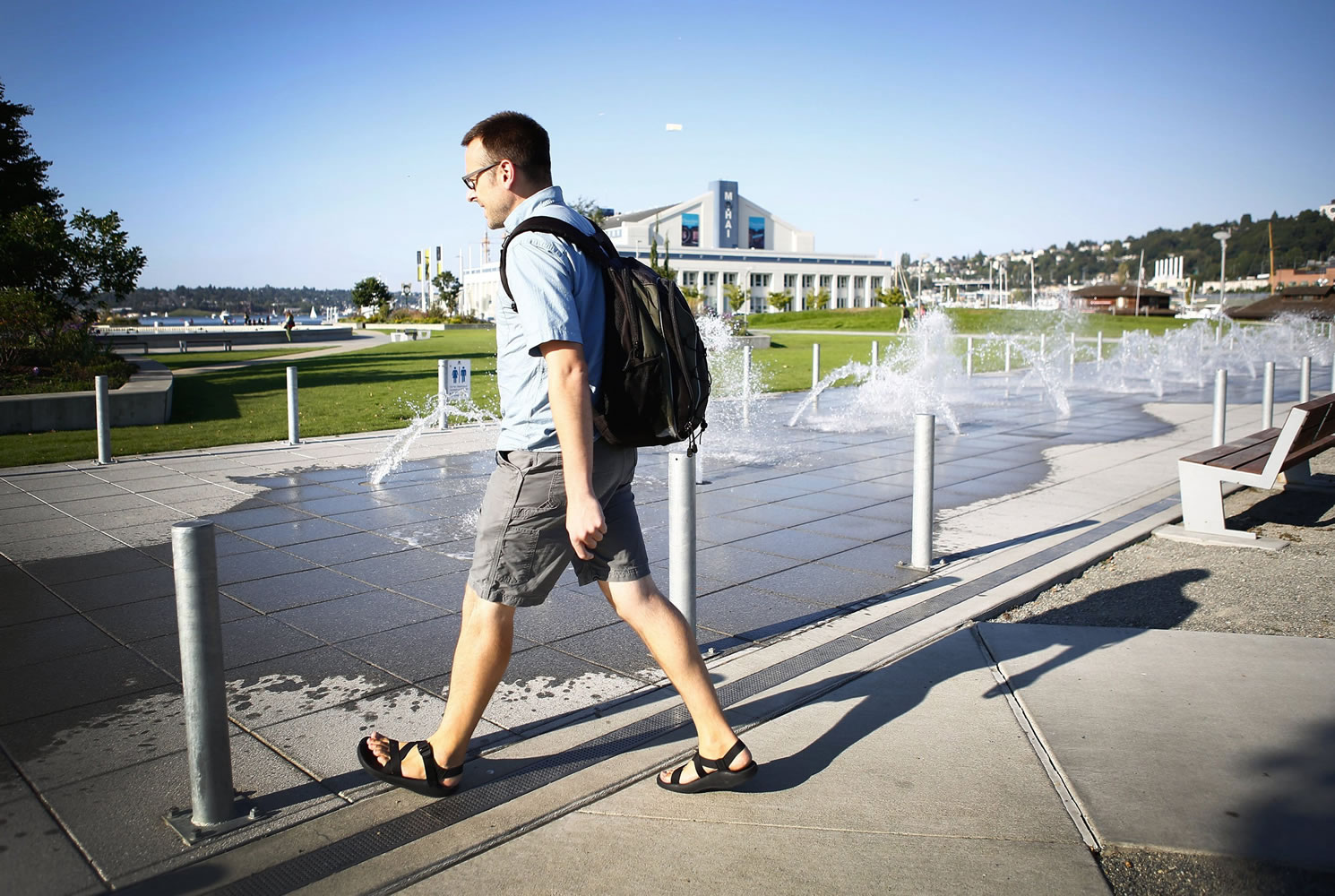 Luke Baylor, an Amazon.com employee, walks past a water feature at Lake Union Park in Seattle on his 3-mile commute home.