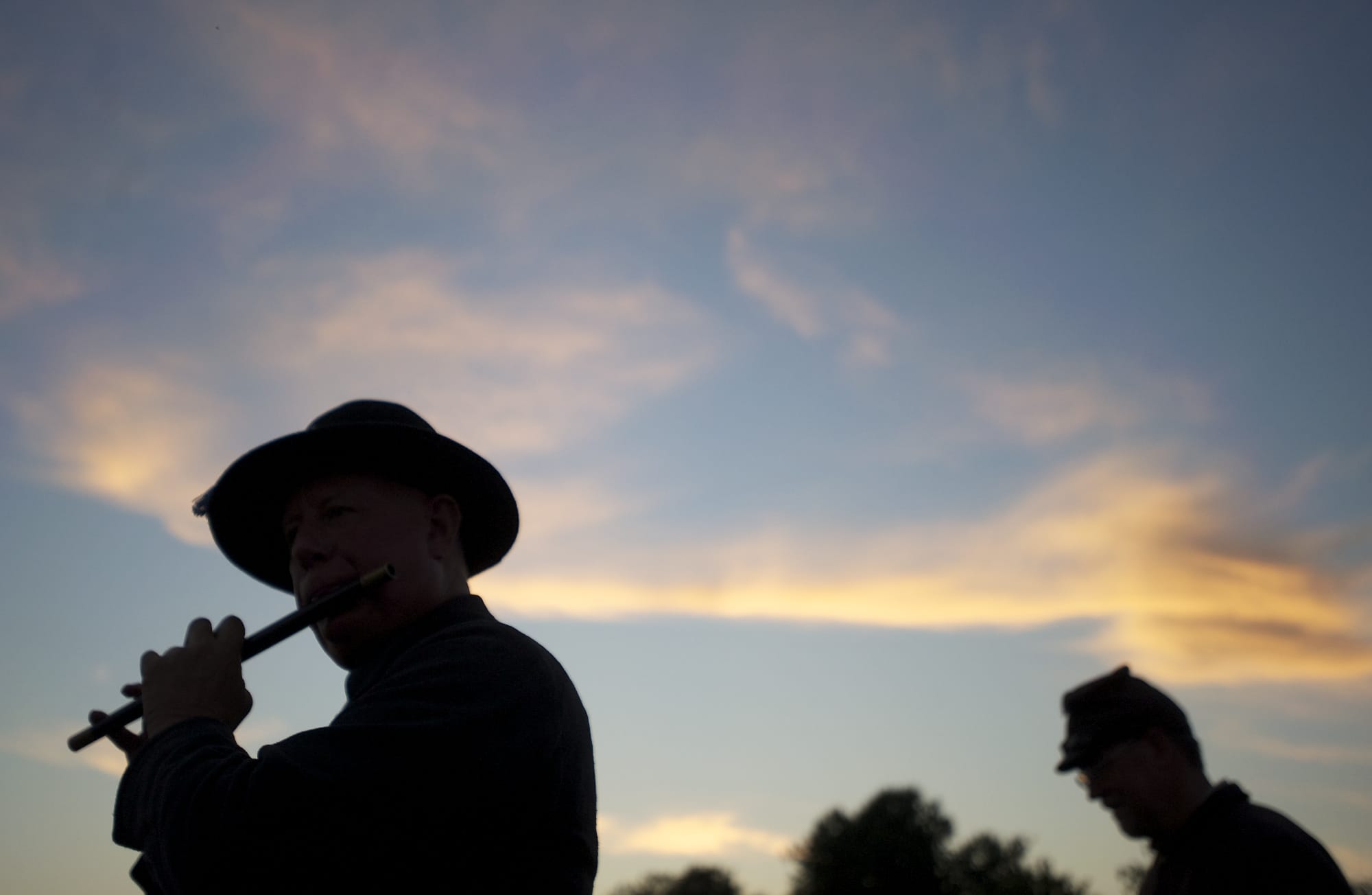 Mitch Rice of Milwaukie, Ore., plays &quot;When Johnny Comes Marching Home&quot; on a fife as a re-enactor in the 1st Oregon Volunteer Infantry during last year's Campfires and Candlelight at Fort Vancouver National Historic Site.