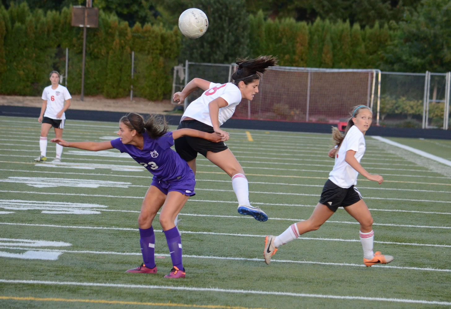 Columbia River's Alexis Dettling, left, vies for the ball with Alyssa Tomasini of Camas in a non-league soccer game Thursday.